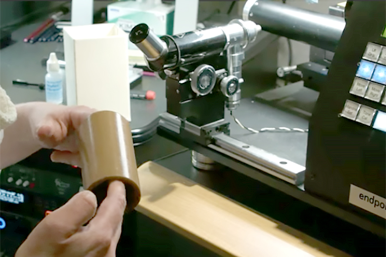 image of wax cylinder being digitized on a machine