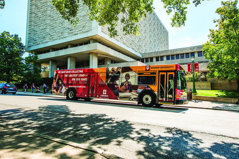 Image of IU campus bus parked in front of Wells Library