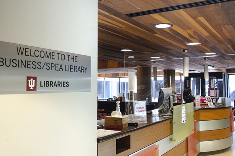 welcome to library sign and entrance business spea