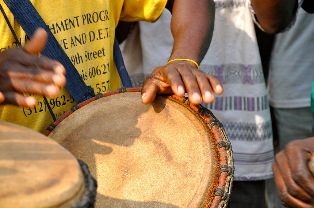 Men play drums at a health fair in Ghana