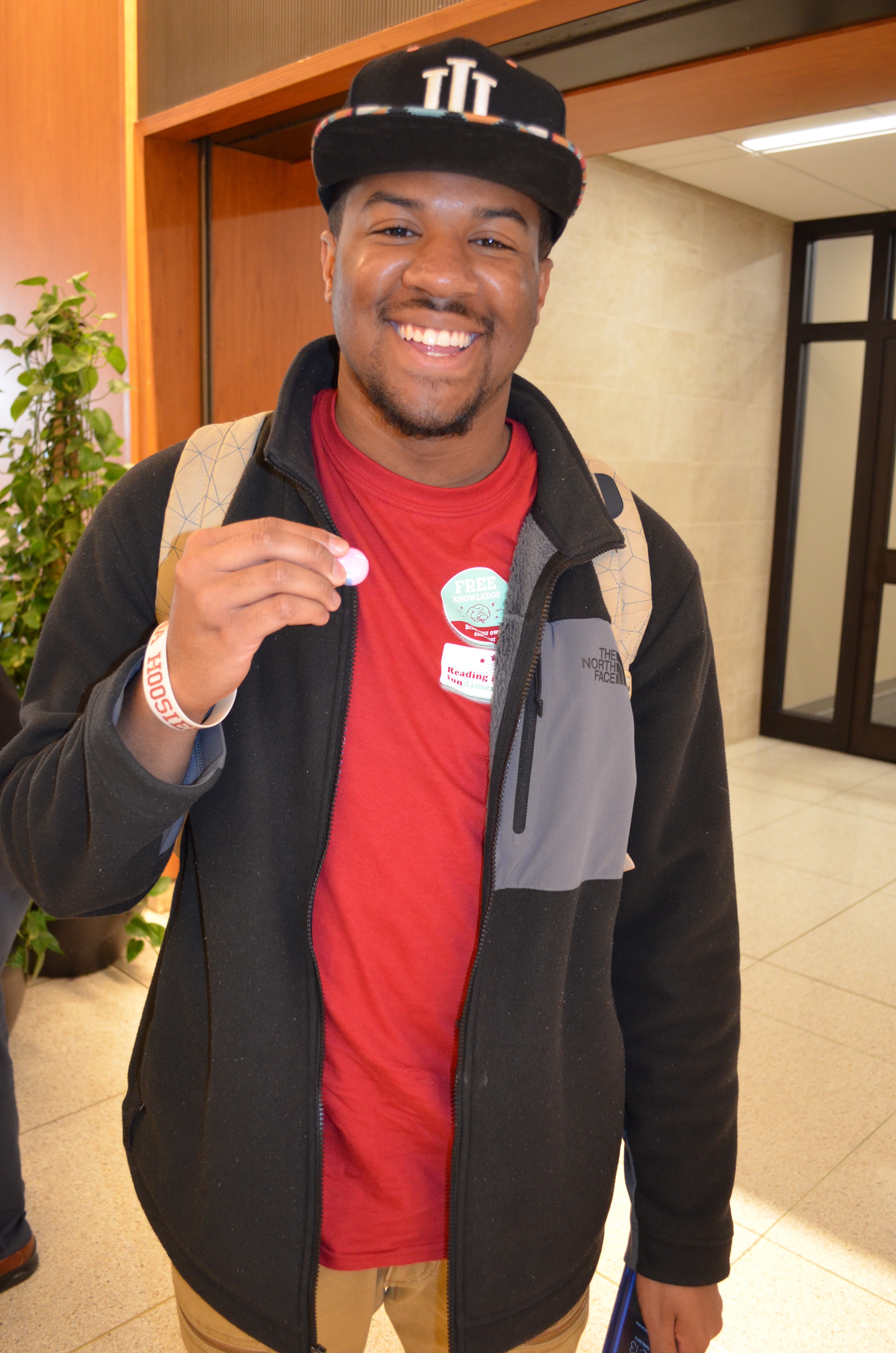 Student Justin Muse shows off his IU Day button