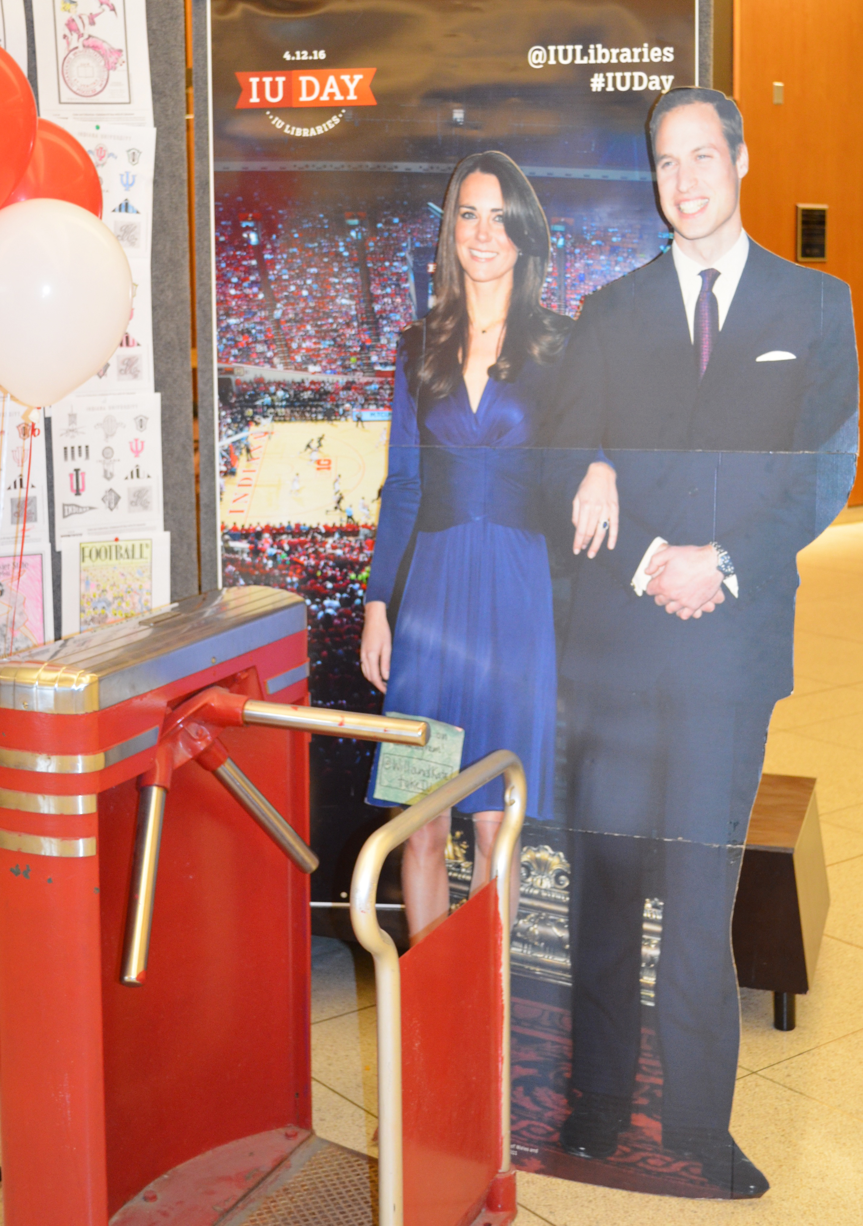 Cardboard cutout of the Royal Couple with the Assembly Hall turnstyle