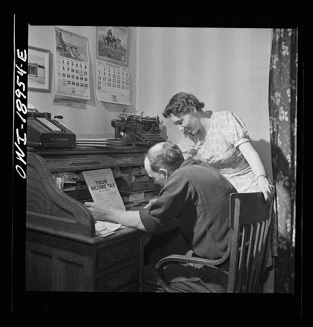 A couple is filling out tax forms