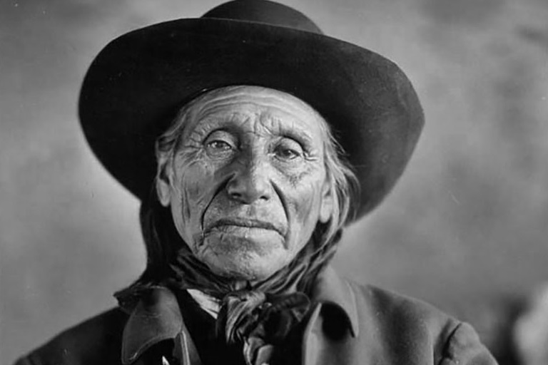 Head and shoulders view of an eldery Lakota man.