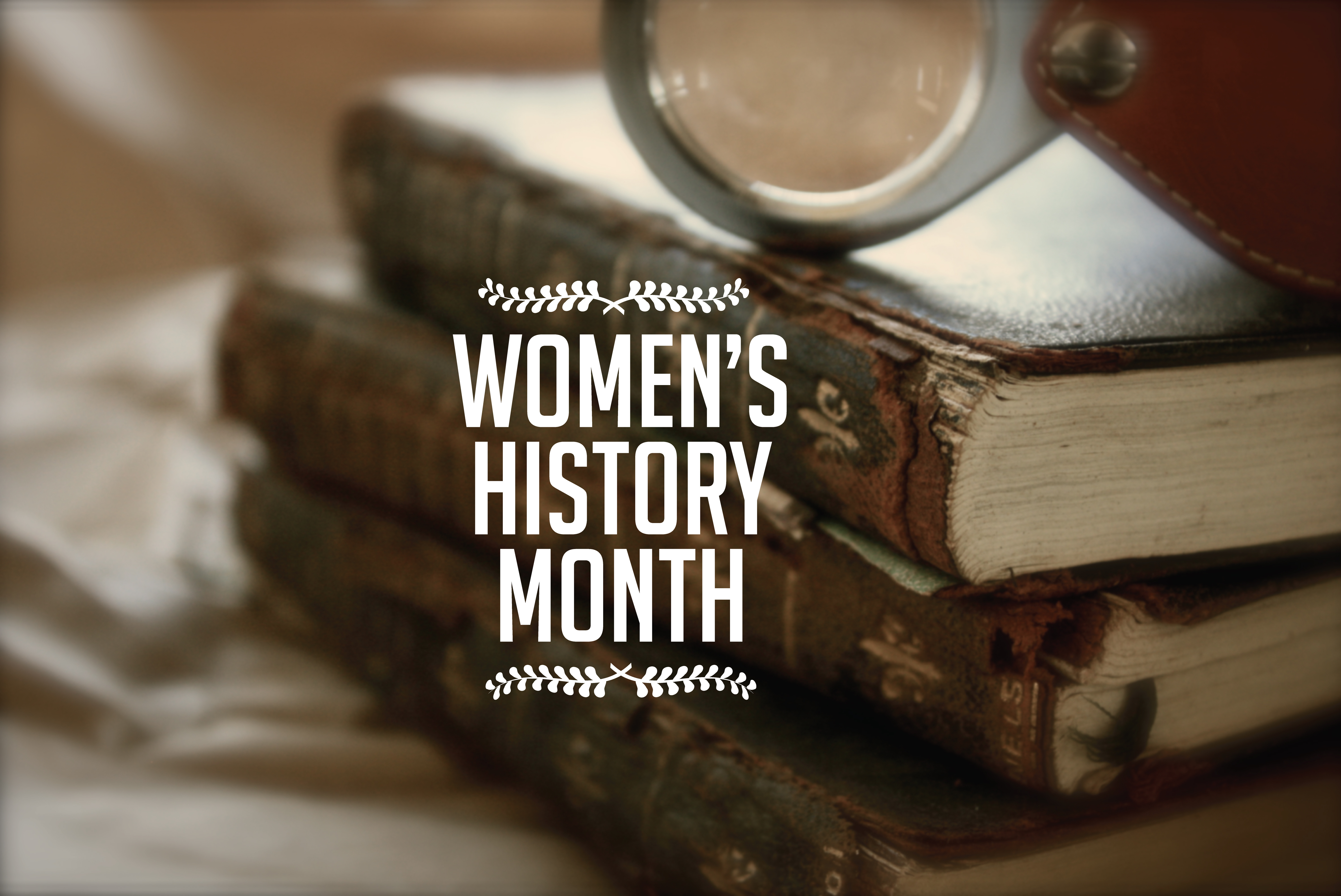 Photograph of books with text overlay "Women's History Month"