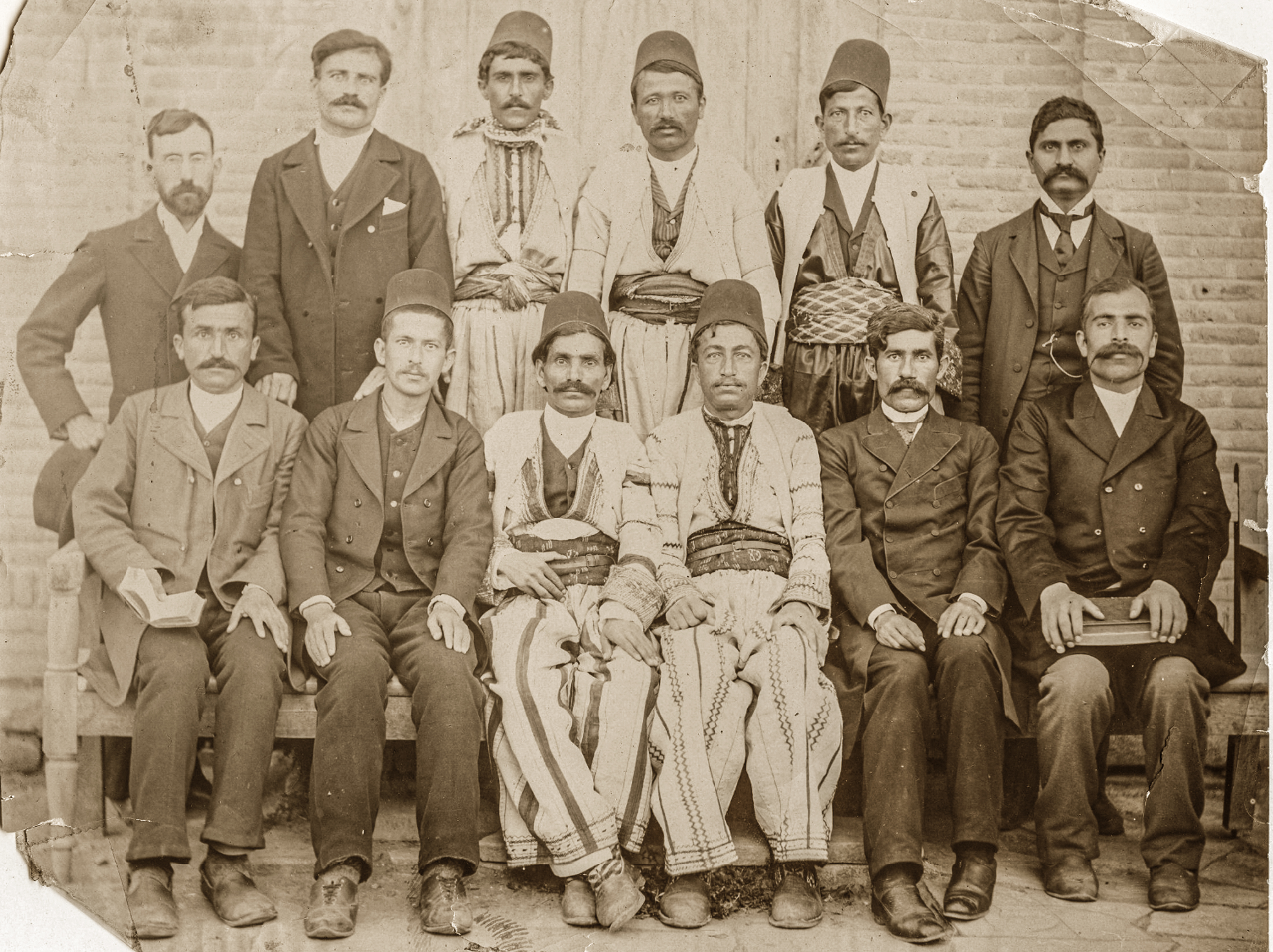 A sepiatone photo depicts a group of students at a theological school in Iran.