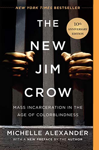 A picture of the 10th anniversary edition of The New Jim Crow. The cover is black with two hands holding jail cell bars. The title is in white font.