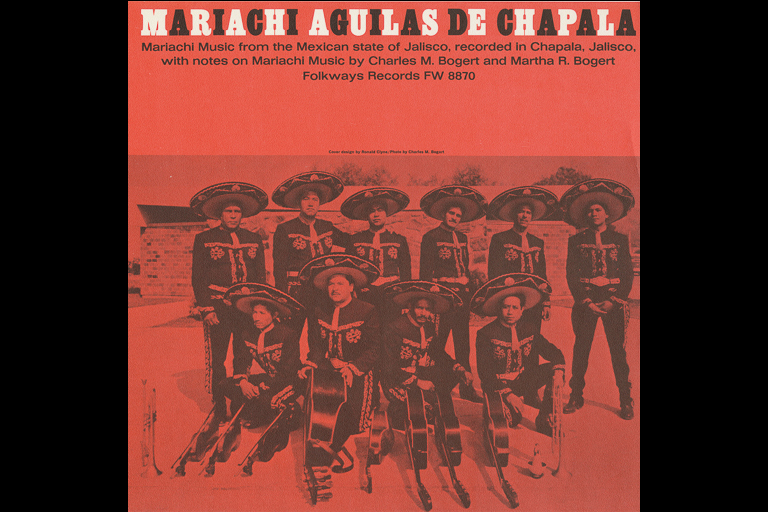 Album cover to "Mariachi Águilas de Chapala" showing a group of men posing in two rows with their instruments and wearing Mariachi clothing and sombreros.