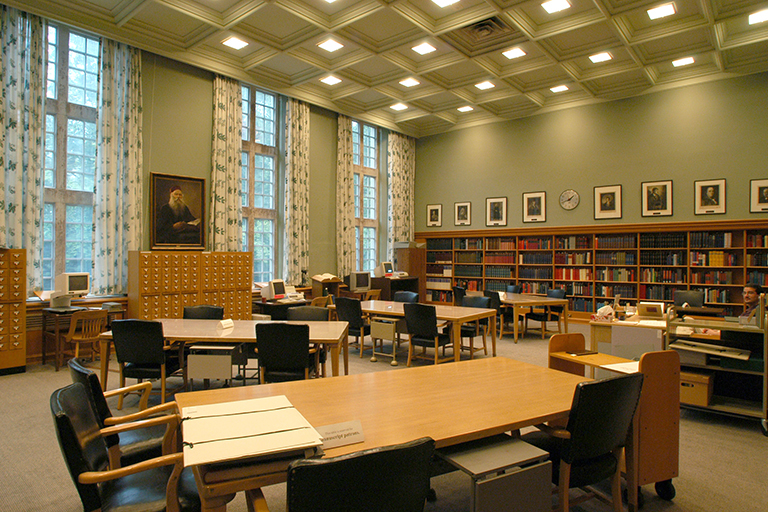 A seafoam green large library reading room pictured in a photo from the early 2000s.