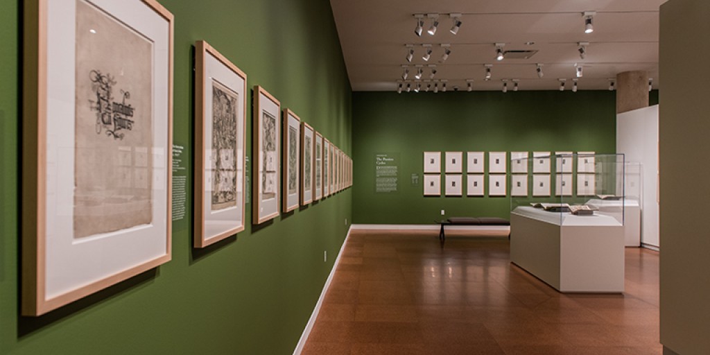 An empty art gallery features framed prints waiting to be viewed.