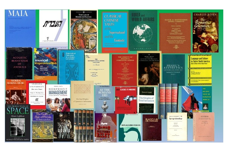 27 volume covers of various sizes ranging from blue to white to brown to green.