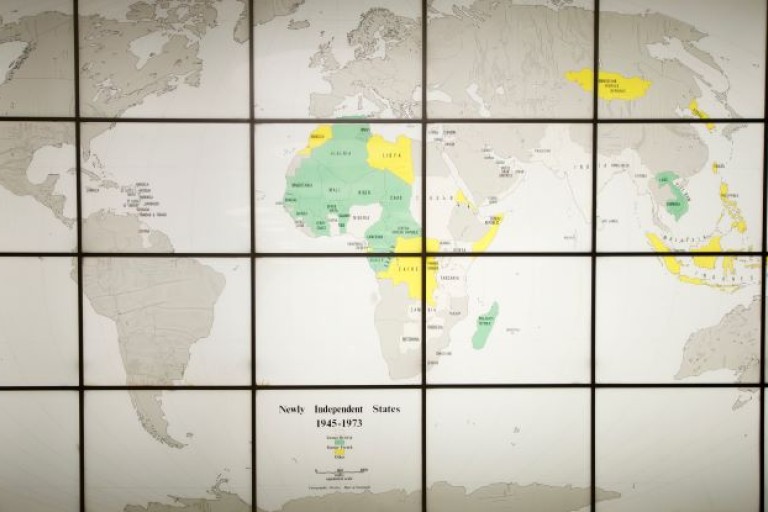 World Map on big screen with grid. Africian countries in green and yellow.