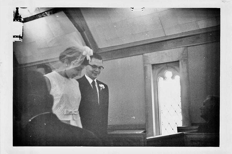 Black and white photo of Jim and Naomi Collins at their wedding in Becks Chapel in 1963.