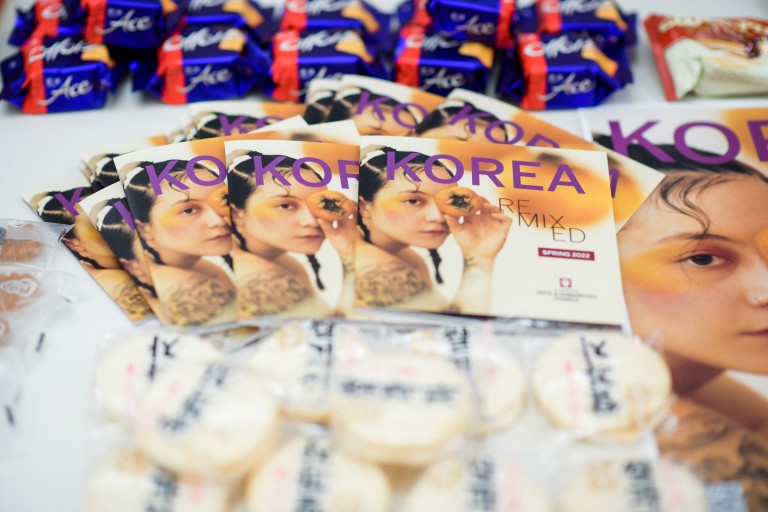 Cookies with Korean writing and Korean Remixed booklets with a woman's face on them.