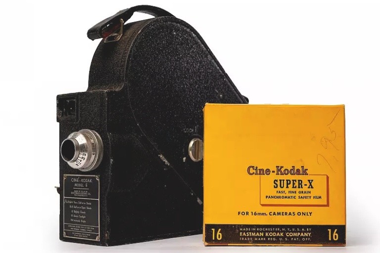 16mm camera and film roll.