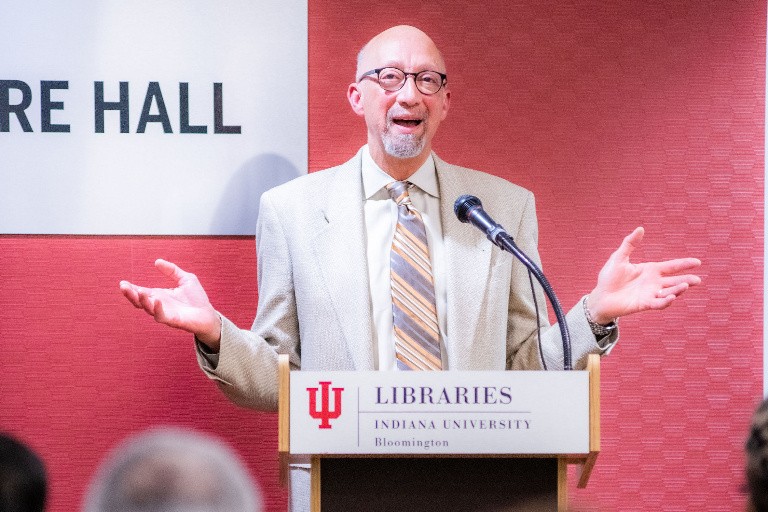 Lester W. Thompson presenting on a podium at a IU Libraries event.
