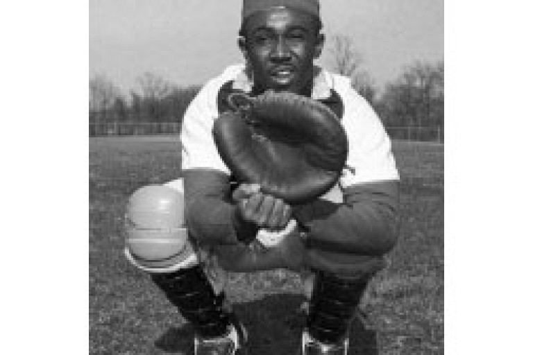 Black and white photograph of baseball player in uniform