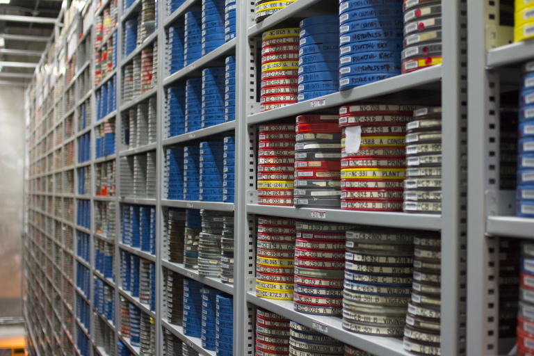 16mm film cans stored in an archival vault