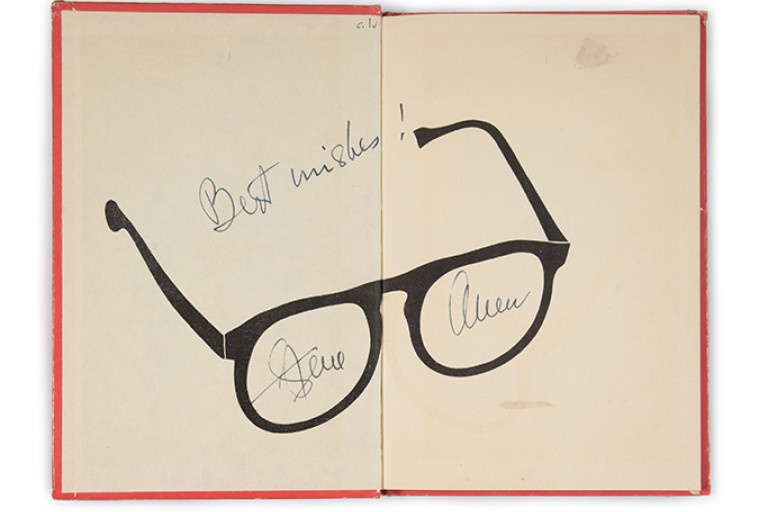 Steve Allen’s signature on the front endpapers of Steve Allen’s Bob Fables. A graphic of the humorist's famed eye glasses is in the center of the spread.