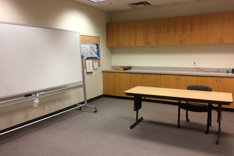 collaboration room with table chair and whiteboard in education library