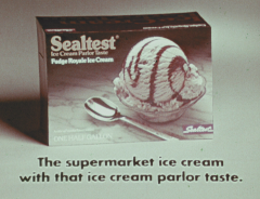 Scoop of Sealtest ice cream in bowl with a spoon.