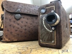 A picture of the 16mm Ciné-Kodak Model B in ostrich leather with matching case. In production from 1927-1931 the Model B was the Cadillac of amateur cameras.